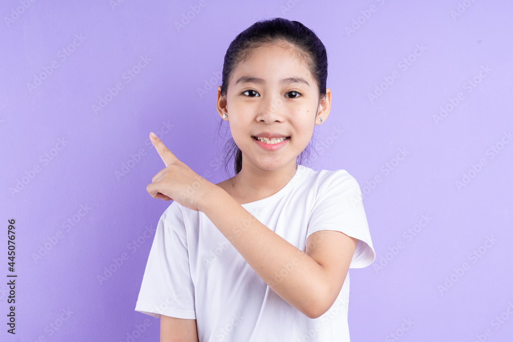 Portrait of Asian child on purple background Portrait of Asian child on purple background