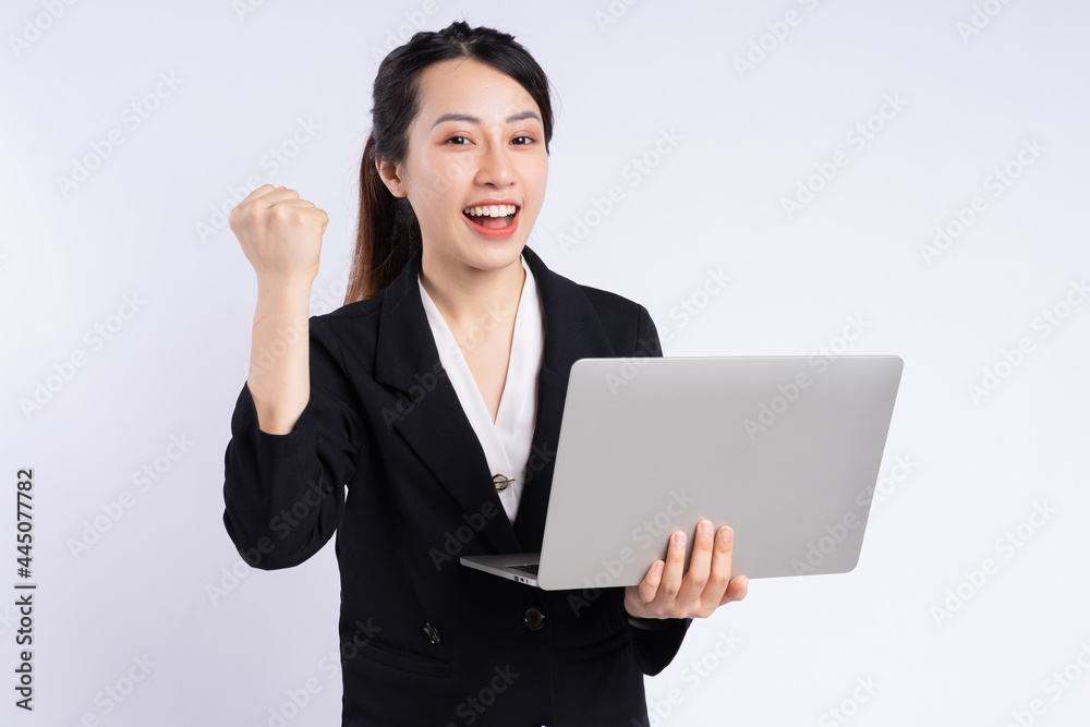 Young Asian businesswoman using laptop on white background Young Asian businesswoman using laptop on white background