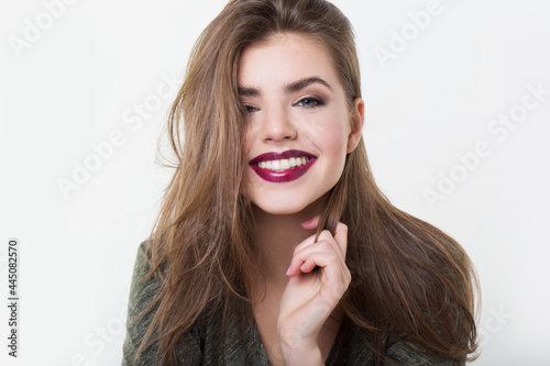 Close-up portrait of beautiful natural woman with charming natural smile,