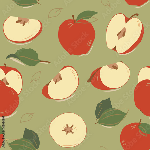 Fototapeta Naklejka Na Ścianę i Meble -  Seamless pattern of fruits. Whole apples, apple halves with leaves on a green background. Color image. Design for fabric, print, wallpaper, packaging, posters.