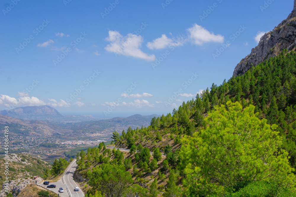 Winding road and agricultural terraces through famous mountain range Coll de Rates Winding road and agricultural terraces through famous mountain range Coll de Rates