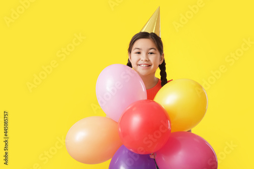 Cute little girl with ballo...