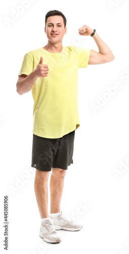 Sporty male coach showing t...