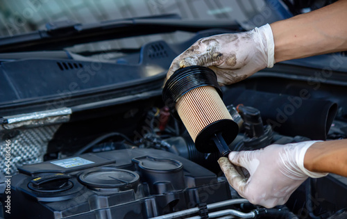 replacing the oil filter on the car.