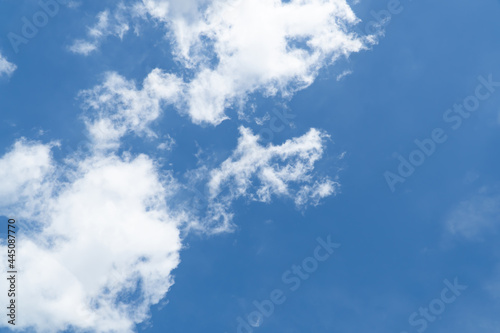 Blue sky with beautiful natural white clouds. Space for text. Background.
