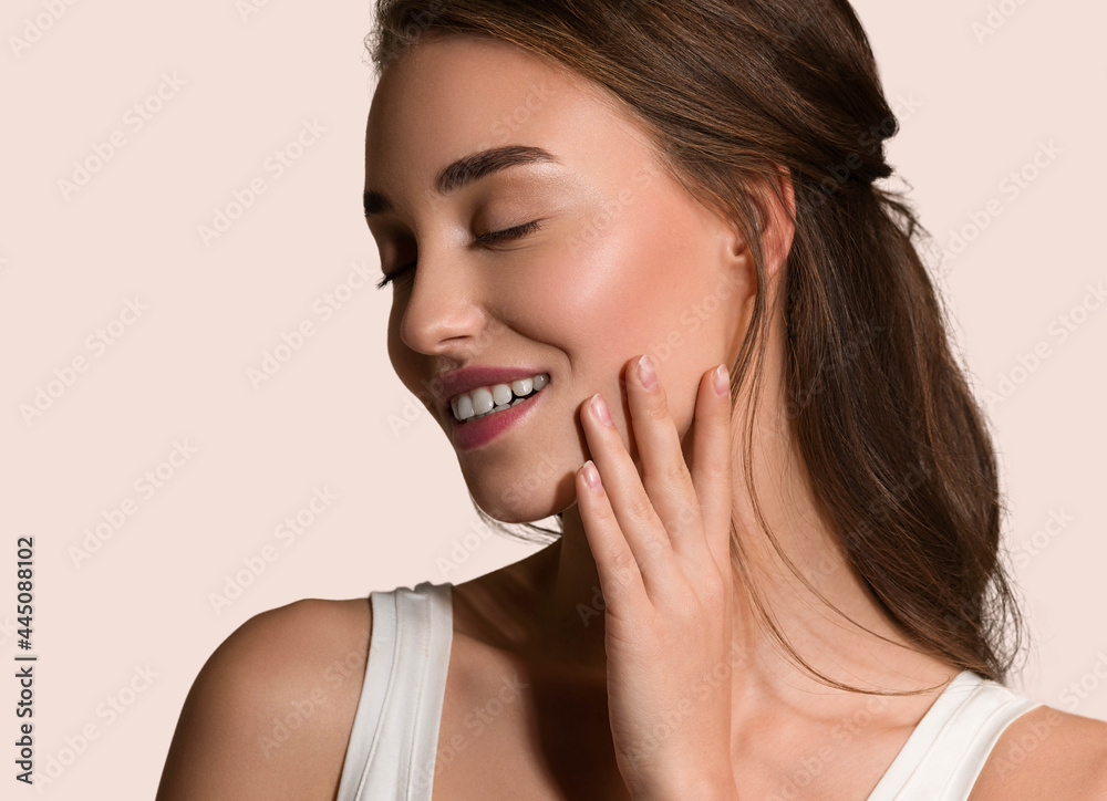 Beauty woman face natural make up healthy skin over color background Beauty woman face natural make up healthy skin over color background