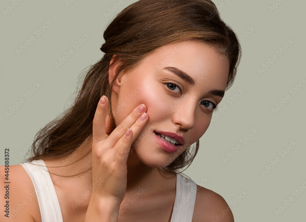 Beauty woman face natural make up healthy skin over color background Beauty woman face natural make up healthy skin over color background