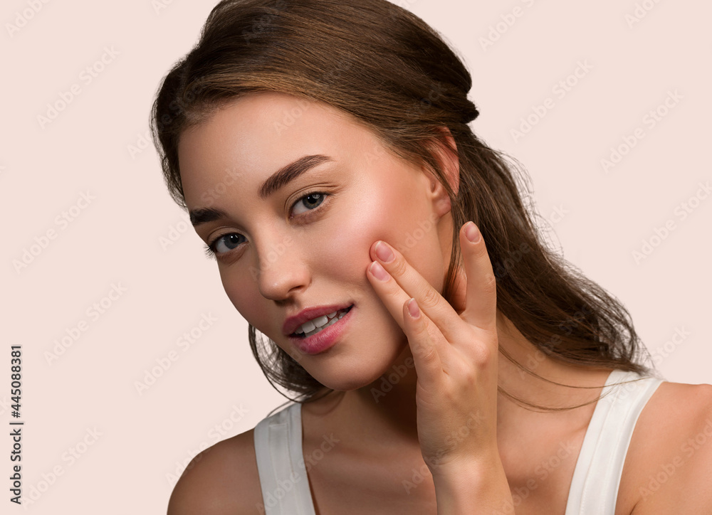 Beauty woman face natural make up healthy skin over color background Beauty woman face natural make up healthy skin over color background