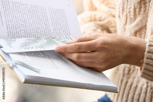 Woman with book and bookmar...