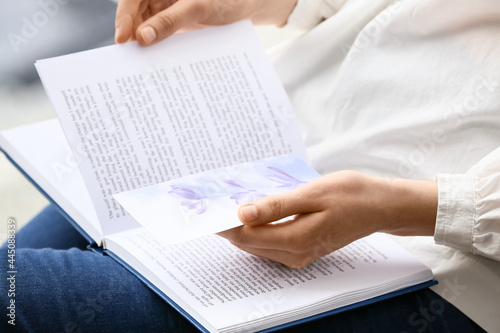 Woman with book and bookmar...