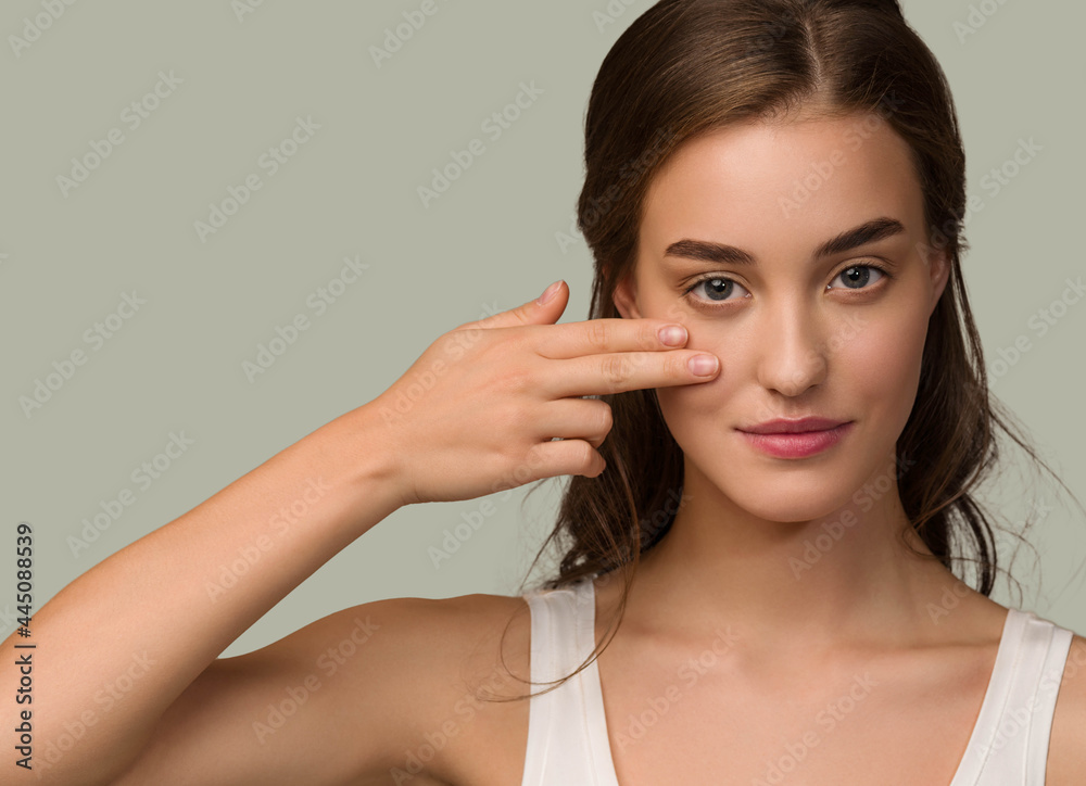 Beauty woman face natural make up healthy skin over color background Beauty woman face natural make up healthy skin over color background