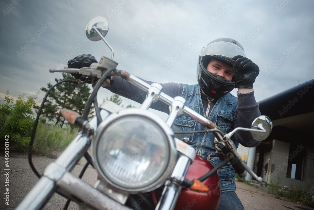 Biker opens a helmet visor close up. Biker opens a helmet visor close up.