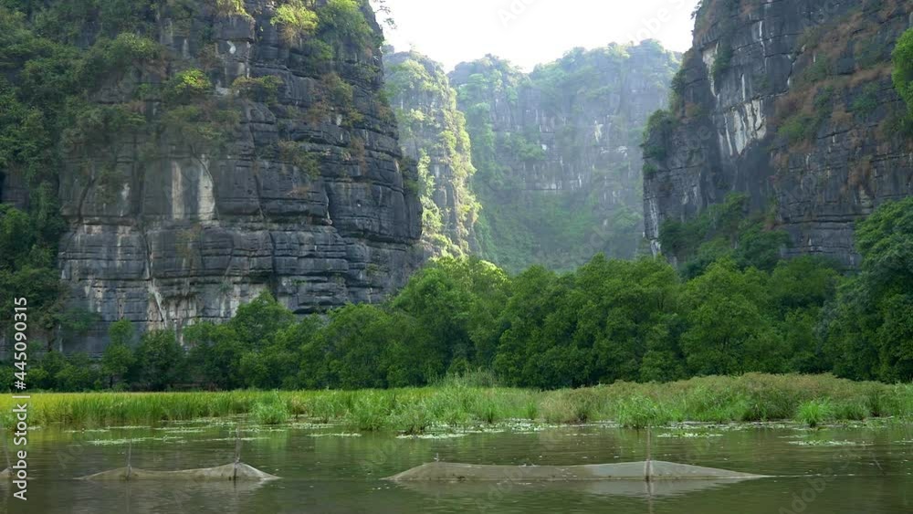 Rice paddies and amazing rock formations along the Sao Khe River near the town of Ninh Binh, Vietnam. Rice paddies and amazing rock formations along the Sao Khe River near the town of Ninh Binh, Vietnam.