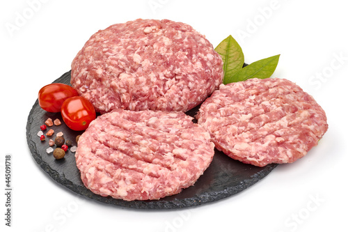 Burger patties, ready to fry, burger cutlets, isolated on white background. High resolution image.