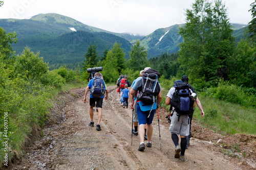 Group of tourists walking along the mountain