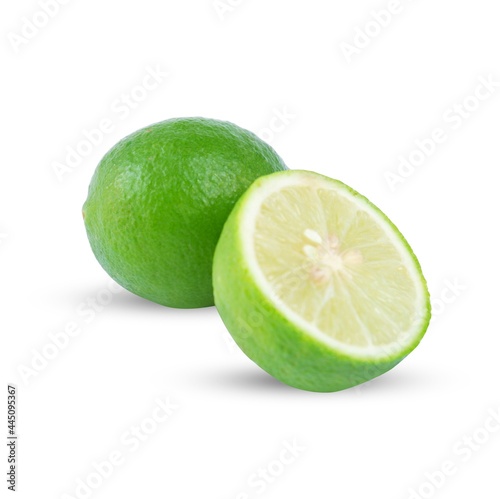 Lime(Citrus × aurantifolia) with slices or slices and leaves, isolated on a white background