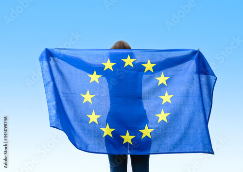Woman with flag of European Union outdoors