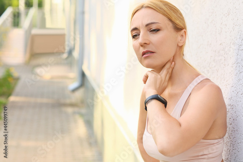 Female runner checking puls...