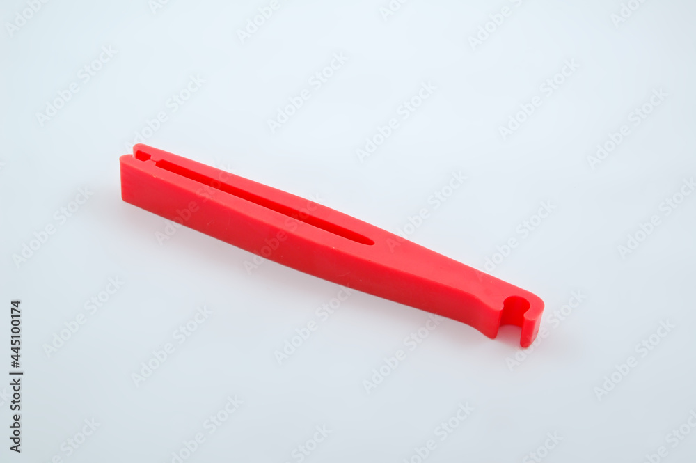 Red plastic clip tool for car repair and emergency