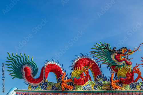 Chinese dragon statue on a roof of a temple photo