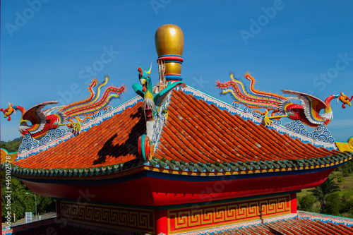 Chinese dragon statue on a roof of a temple photo