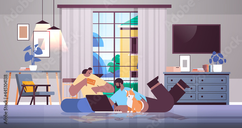 african american couple with credit card using laptop online shopping concept man woman ordering goods together