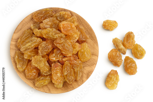 Yellow raisins in wooden bowl isolated on white background with clipping path. Top view. Flat lay