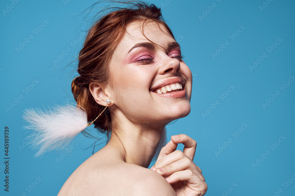 woman with bare shoulders bright makeup decoration fashion blue background - obrazy, fototapety, plakaty 