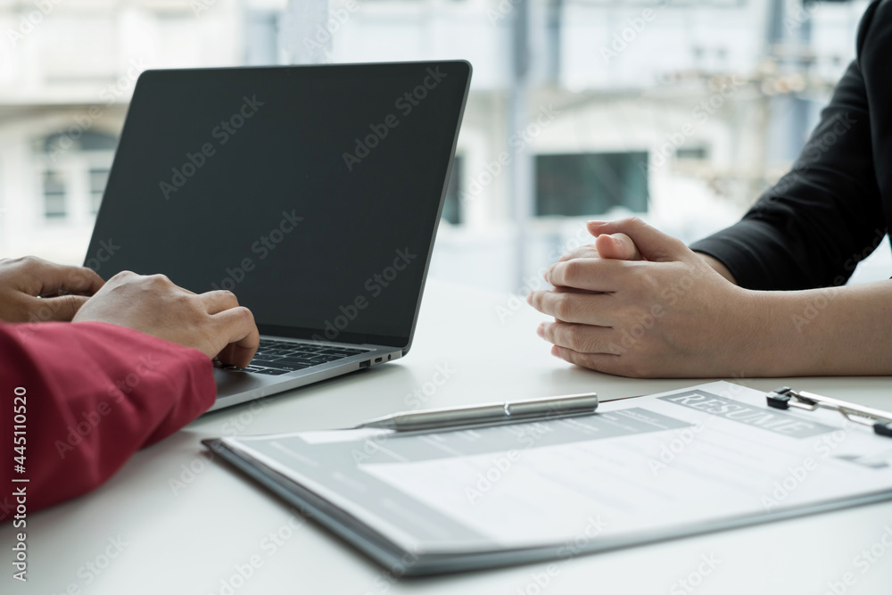 Business people hold a resume and talk to work applicants for work interviews about careers and Their personal history in the company. Recruitment concepts Business people hold a resume and talk to work applicants for work interviews about careers and Their personal history in the company. Recruitment concepts