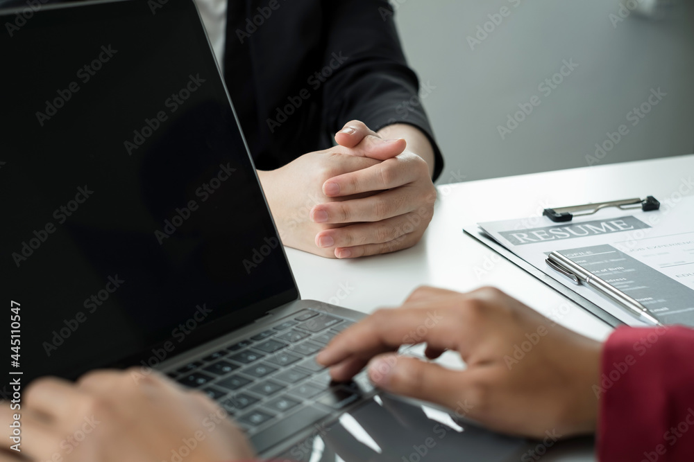 Business people hold a resume and talk to work applicants for work interviews about careers and Their personal history in the company. Recruitment concepts Business people hold a resume and talk to work applicants for work interviews about careers and Their personal history in the company. Recruitment concepts