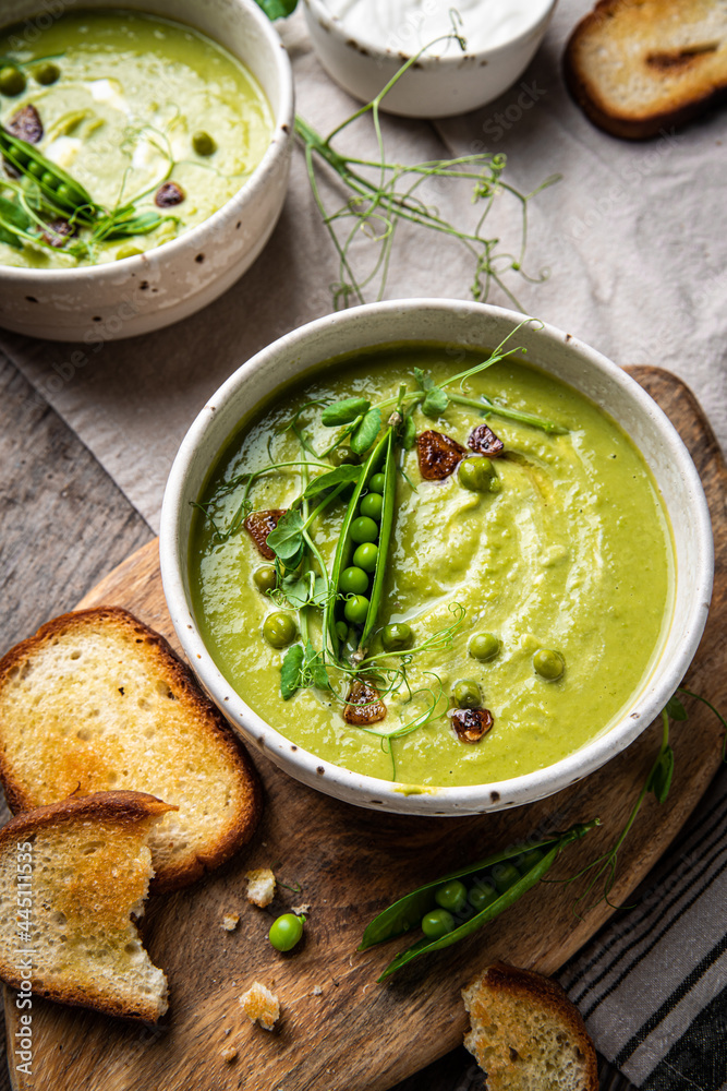 Cream of green peas soup with toasts and sour cream. Cream of green peas soup with toasts and sour cream.