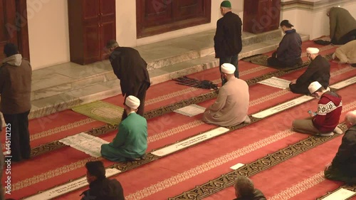 Muslim eid congregation praying.Mosque teacher imam is reading the Quran.Reads Qur'an interior god religion mysterious religious islam moslem place of worship prayer temple azan salaah spirituality 4K photo