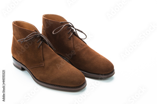 Male Footwear Ideas. Closeup of Pair of Mens Brown Suede Boots Against White Background.