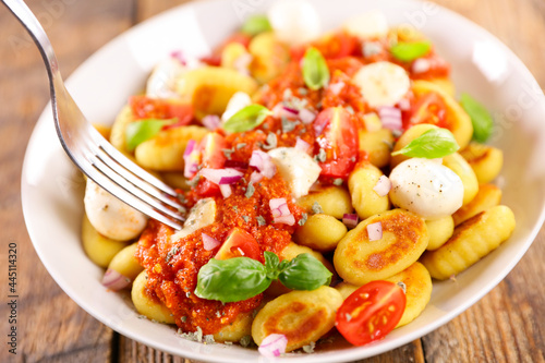 gnocchi with tomato sauce and mozzarella photo
