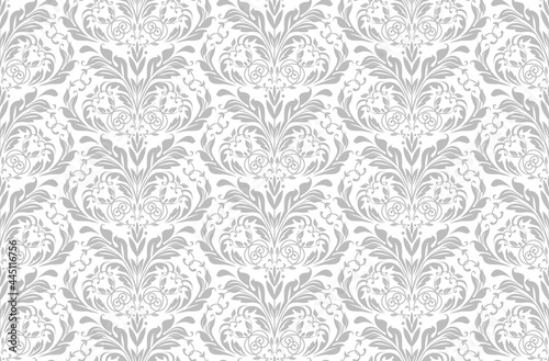 Wallpaper in the style of Baroque. Seamless vector background. White and gray floral ornament. Graphic pattern for fabric, wallpaper, packaging. Ornate Damask flower ornament.