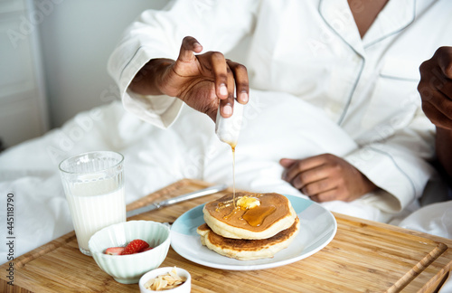 A person having breakfast in bed