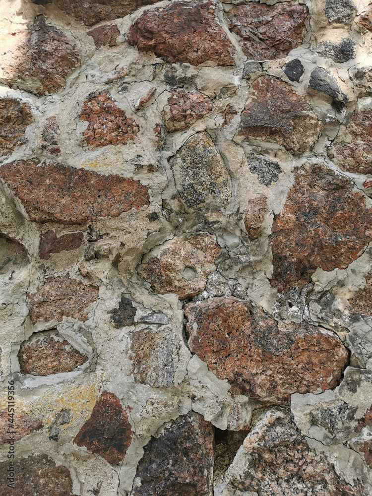 Fototapeta premium The outer stone wall of the Vyborg Castle in the city of Vyborg