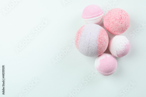 Pink bath balls on white background, space for text