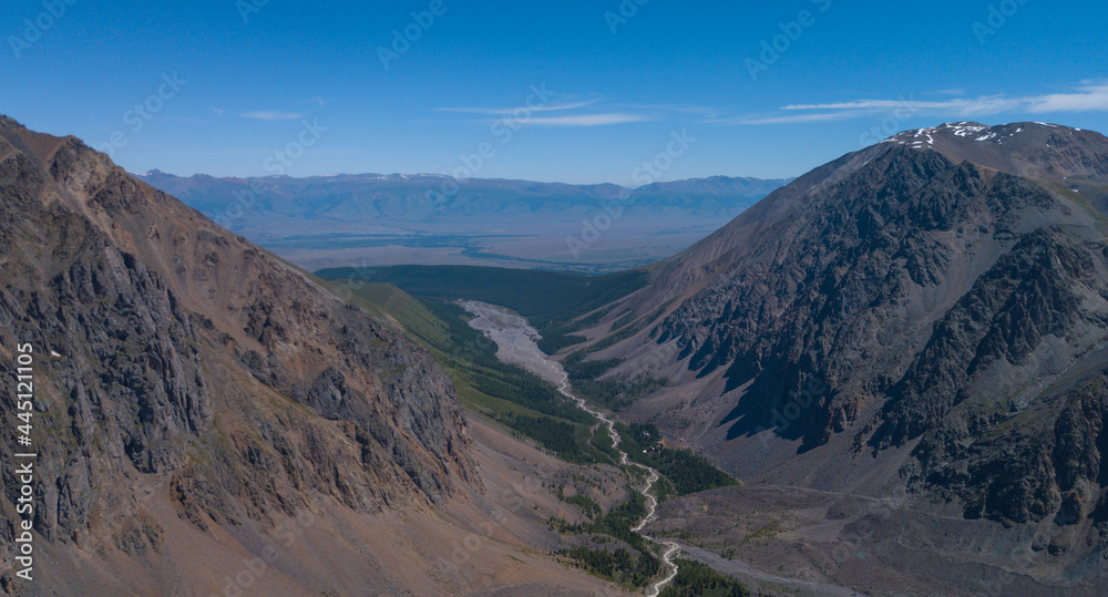 Panoramic aerial view of the gorge of the Aktru river valley and the Kurai steppe in the distance, Altai photo by drone