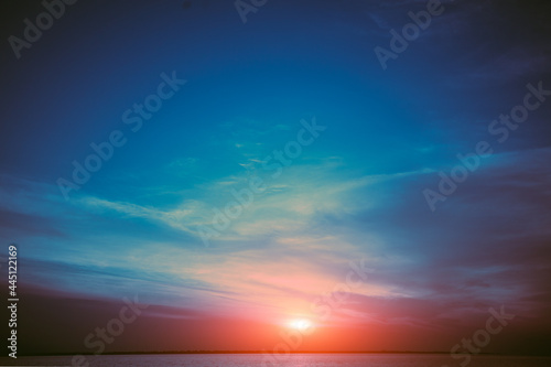 Colorful cloudy sky over the sea at sunset. Sky texture, abstract nature background © vvvita