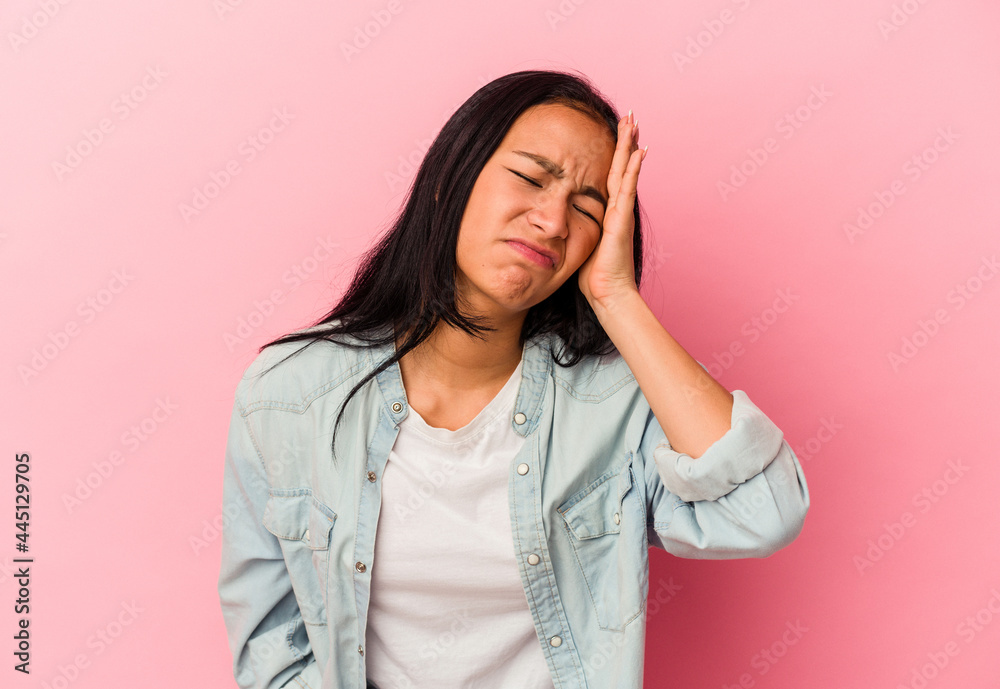 Young Venezuelan woman isolated on pink background tired and very sleepy keeping hand on head. Young Venezuelan woman isolated on pink background tired and very sleepy keeping hand on head.