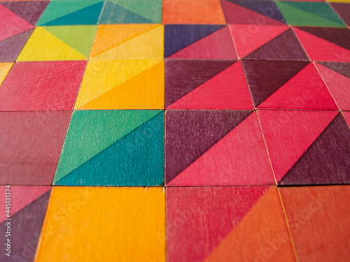 colored woode cubes forming a texture - close up