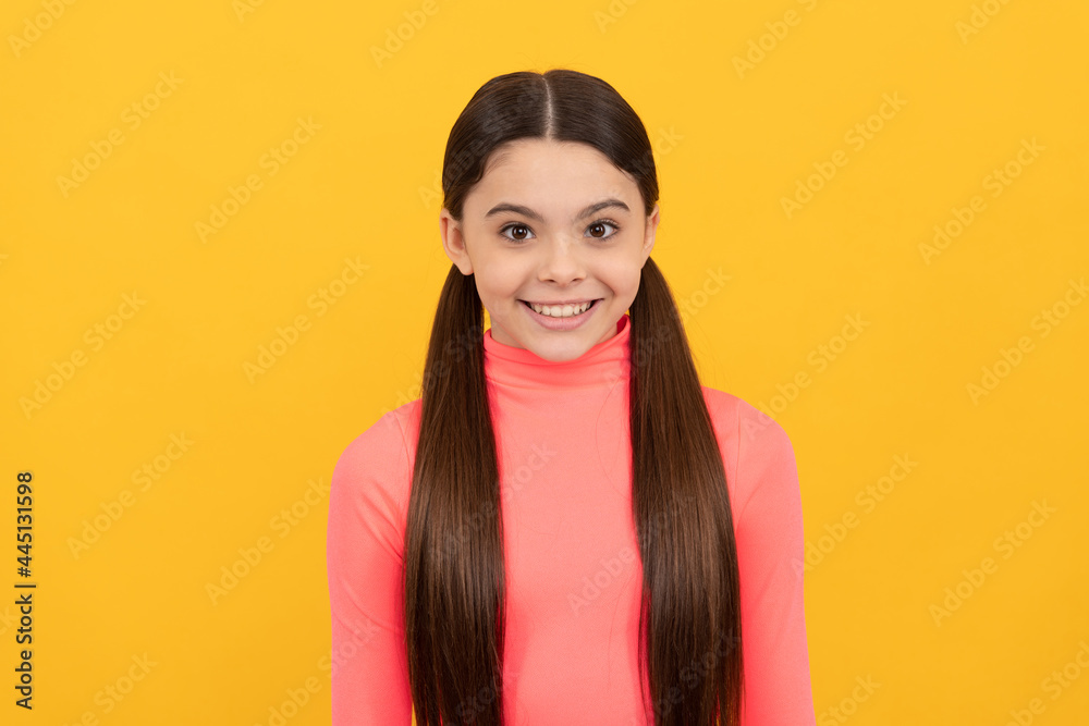 cheerful kid with long hair. beauty and fashion. female fashion model. cheerful kid with long hair. beauty and fashion. female fashion model.