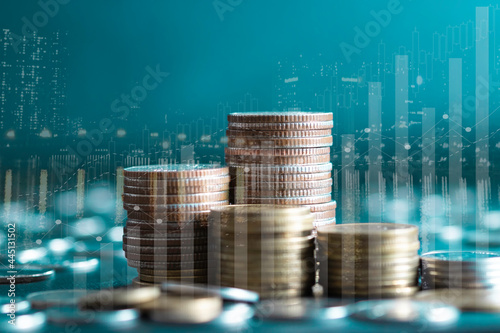Double exposure of stack rows money coin with trading graph chart stock market. Value exchange and marketing of bank fund economic profit with growth. Finance investment and business concept.