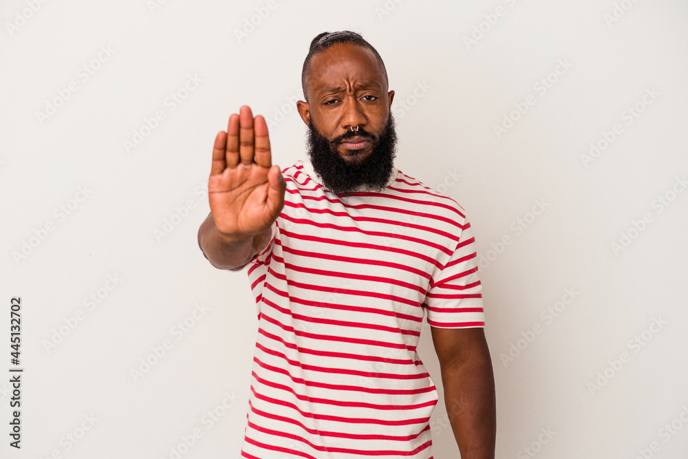 African american man with beard isolated on pink background standing with outstretched hand showing stop sign, preventing you. African american man with beard isolated on pink background standing with outstretched hand showing stop sign, preventing you.