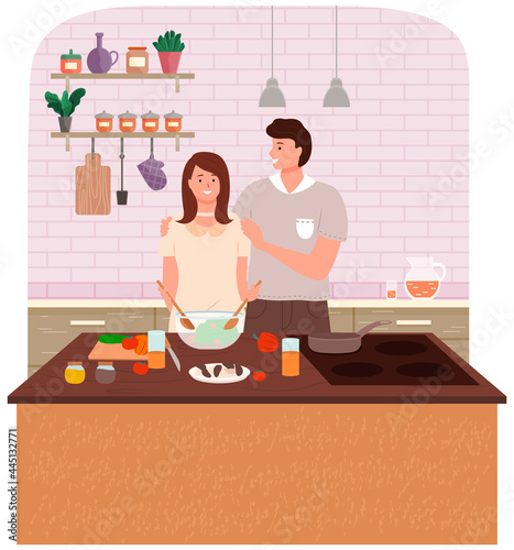Happy family cooking healthy vegetarian food together in kitchen at table. Prepearing family dinner in cook room interior. Young couple make salad, woman cuts vegetables for useful eating home food