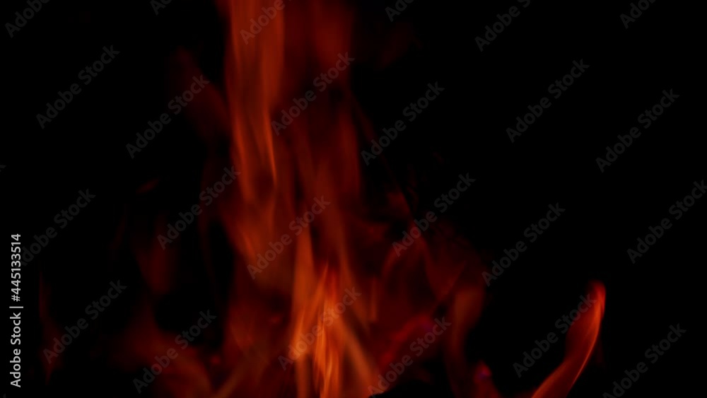 Burning fire, firewood coal in fireplace. Bright flame of burning bonfire in dark on background. Burning fire, firewood coal in fireplace. Bright flame of burning bonfire in dark on background.