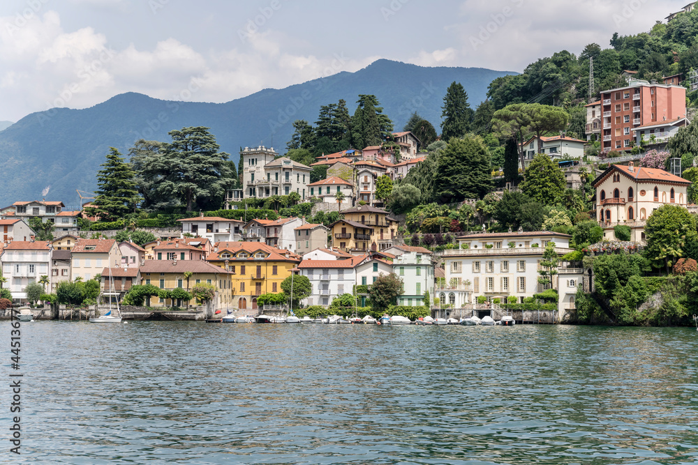 old houses on lakeside at green lake shore, Como, Italy