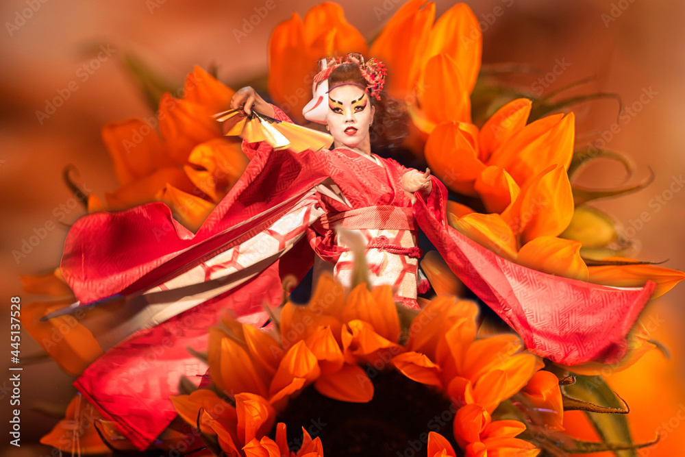 Japanese woman dances with a fan. Collage with flowers. Traditional Japanese performance, red fox dance. Kino Kitsune fox is a character in Japanese legends.