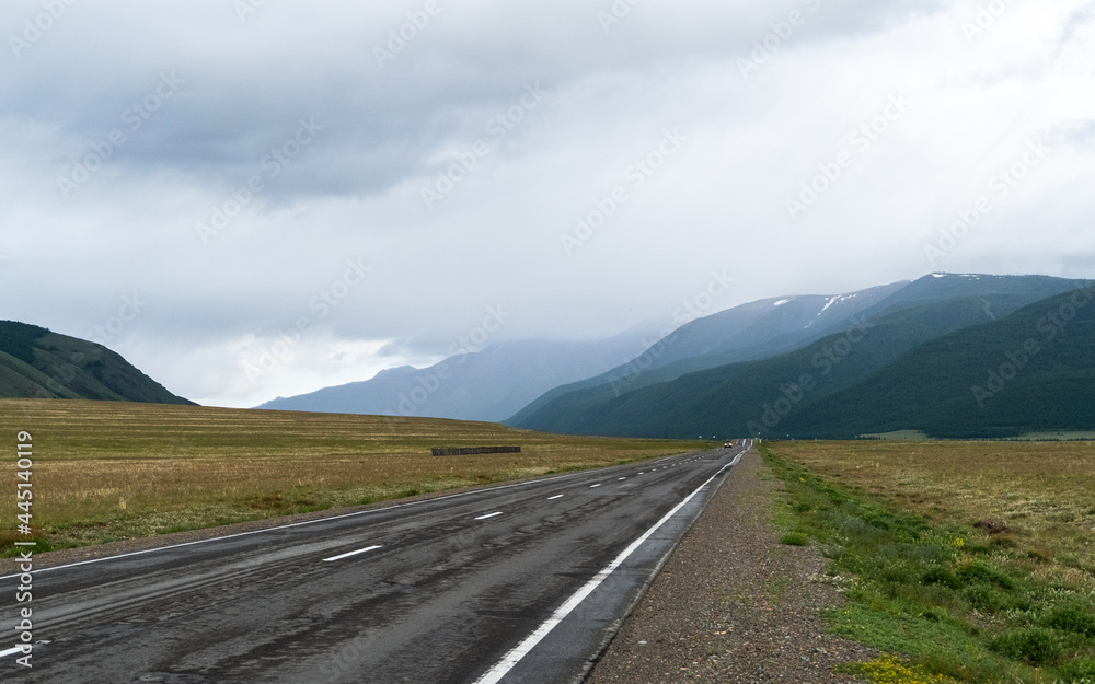 Naklejka premium road, mountains, clouds and sky